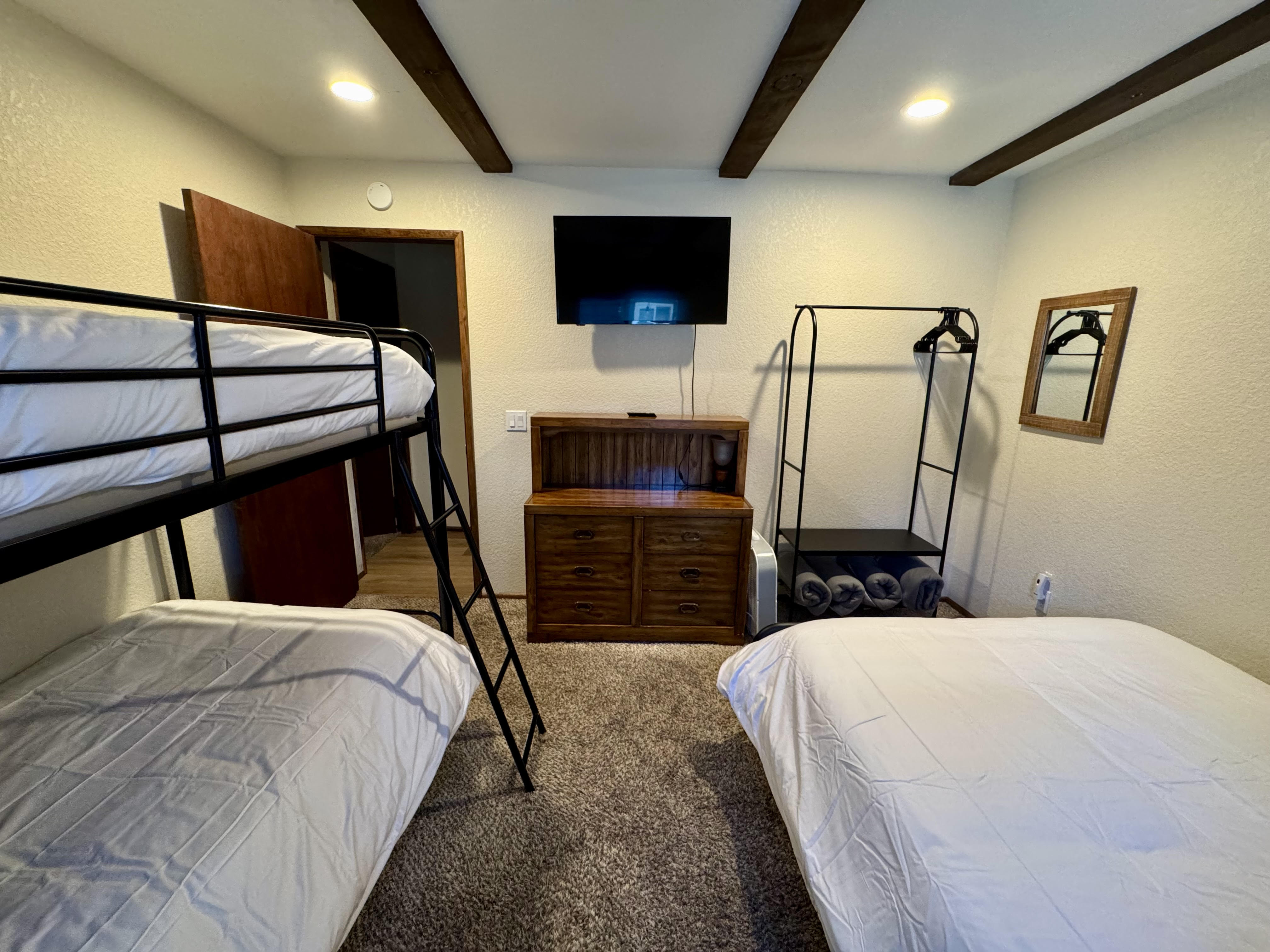 Bunk room at Bear View Escape with a twin-over-twin bunk and a full bed