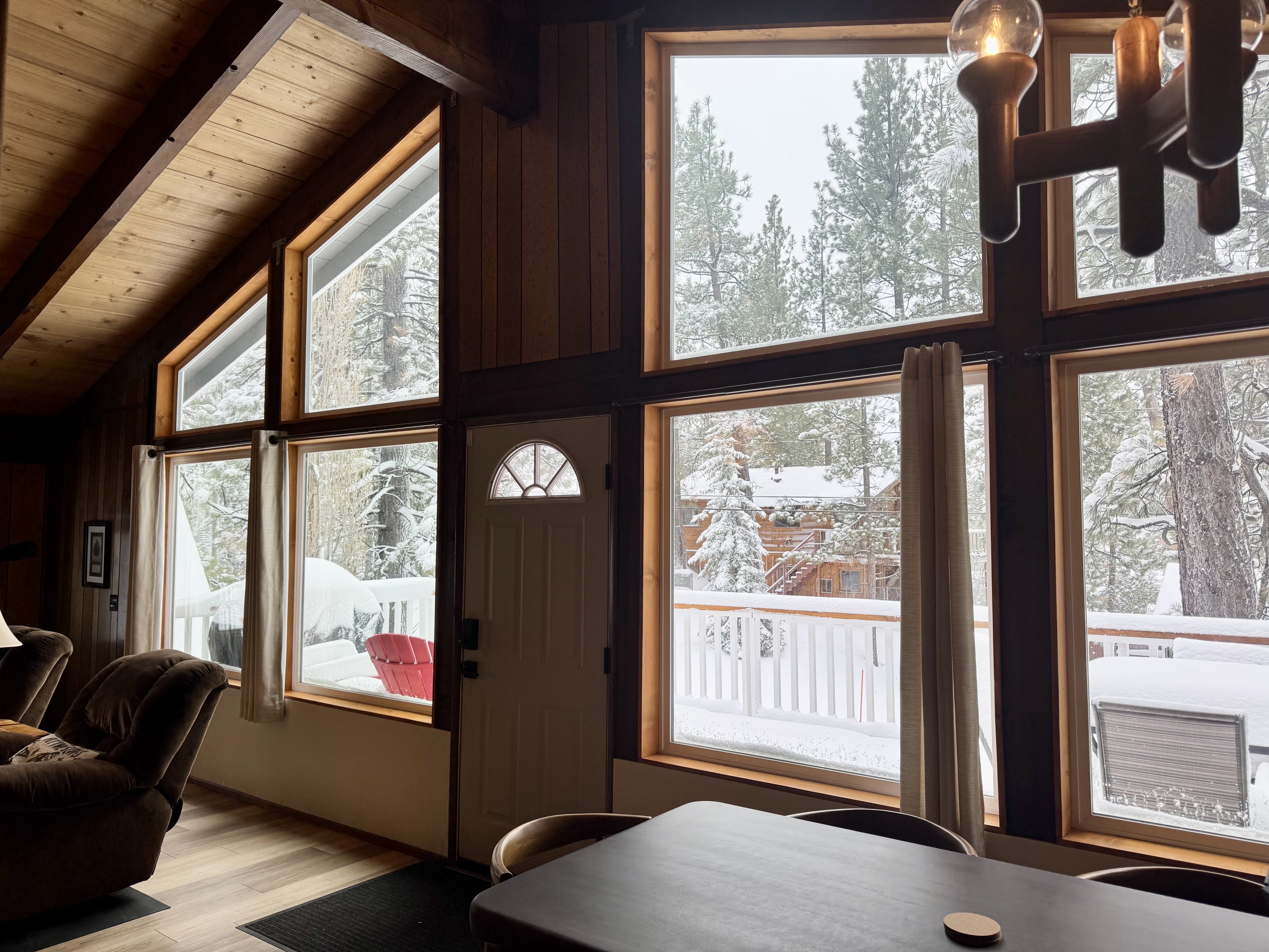 Dining area with large windows and forest views at Bear View Escape